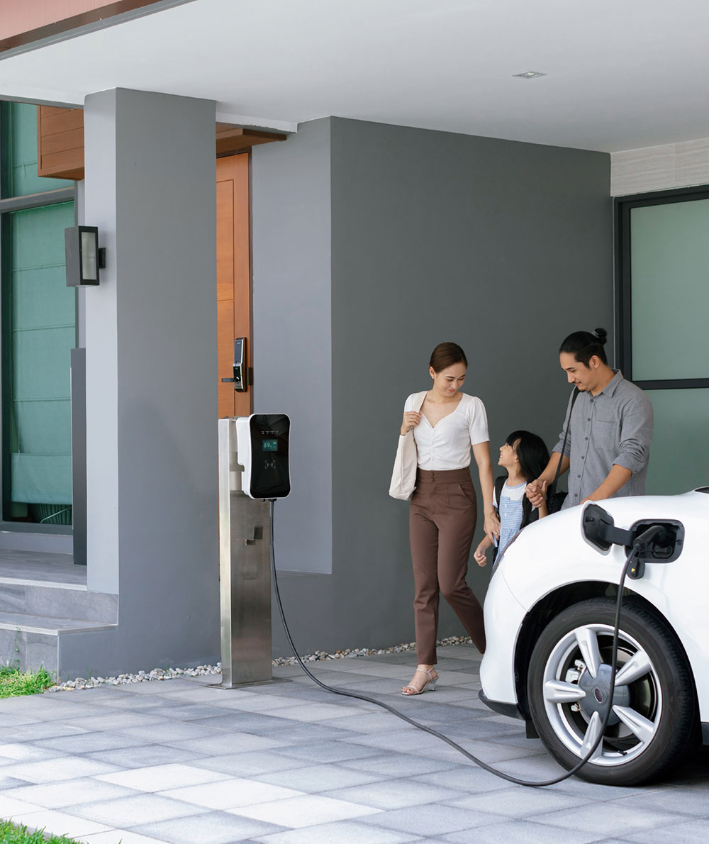 progressive-young-parents-daughter-living-home-with-electric-car